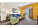 Living room features a sofa, two armchairs, and a coffee table at 8112 Poinciana Blvd # 1305, Orlando, FL 32821