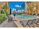 Resort-style pool with plenty of lounge chairs for relaxing at 8112 Poinciana Blvd # 1305, Orlando, FL 32821