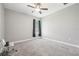 Spacious bedroom with ceiling fan and plush carpeting at 1018 E 10Th St, Sanford, FL 32771