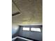 Loft bedroom ceiling with two windows at 34 Saint Andrews Ct, Kissimmee, FL 34759
