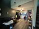 Open living room and kitchen area with laminate flooring at 34 Saint Andrews Ct, Kissimmee, FL 34759