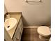 Small bathroom with toilet and sink at 34 Saint Andrews Ct, Kissimmee, FL 34759