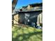 Back patio with screen enclosure and AC unit at 34 Saint Andrews Ct, Kissimmee, FL 34759