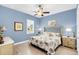 Bright bedroom with a king-size bed and light wood flooring at 2721 Swoop Cir, Kissimmee, FL 34741