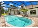 Inviting kidney-shaped pool with screened enclosure at 8368 Rambling River Dr, Sanford, FL 32771