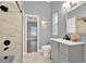 Modern bathroom with gray vanity and tiled shower at 250 Shady Oaks Cir, Lake Mary, FL 32746