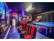 Fun game room, featuring foosball, ping pong, and gaming chairs at 9101 El Caro Ln, Davenport, FL 33896