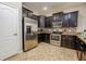 Modern kitchen with stainless steel appliances and granite countertops at 9101 El Caro Ln, Davenport, FL 33896