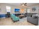 Relaxing living room with comfortable seating and large TV at 9101 El Caro Ln, Davenport, FL 33896