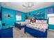 bedroom with Finding Nemo mural, two twin beds and blue accents at 9101 El Caro Ln, Davenport, FL 33896