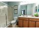 Bathroom with double vanity and walk-in shower at 9101 El Caro Ln, Davenport, FL 33896