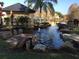 Relaxing water feature with a gazebo and lush landscaping at 4642 Commander Dr # 933, Orlando, FL 32822