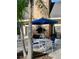 Outdoor patio with table, chairs, and brick fireplace at 3970 Versailles Dr # 3970B, Orlando, FL 32808