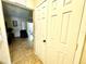 Hallway with tiled floor leading to living room at 3970 Versailles Dr # 3970B, Orlando, FL 32808