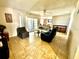 Living room with tiled floor, sofas and access to patio at 3970 Versailles Dr # 3970B, Orlando, FL 32808