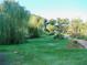 Landscaped grounds with mature trees and a brick pathway at 3970 Versailles Dr # 3970B, Orlando, FL 32808
