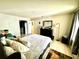 Main bedroom with large bed and dresser at 3970 Versailles Dr # 3970B, Orlando, FL 32808