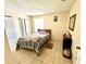 Cozy bedroom with window and double door closet at 3970 Versailles Dr # 3970B, Orlando, FL 32808
