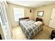 Cozy bedroom with window and double door closet at 3970 Versailles Dr # 3970B, Orlando, FL 32808