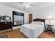 Bedroom with a full-size bed and wooden dresser at 675 Shady Nook Dr, Clermont, FL 34711