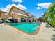 Inviting pool area with ample lounge chairs and patio furniture at 102 Via Duomo, New Smyrna Beach, FL 32169