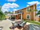 Outdoor patio with seating area and fire pit at 102 Via Duomo, New Smyrna Beach, FL 32169