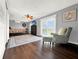 Spacious bedroom with wood floors, large windows and comfortable seating at 102 Via Duomo, New Smyrna Beach, FL 32169