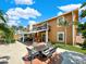 Spacious backyard with patio, seating area, and canal views at 102 Via Duomo, New Smyrna Beach, FL 32169