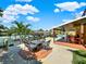 Relaxing patio with fire pit and seating area, overlooking the canal at 102 Via Duomo, New Smyrna Beach, FL 32169