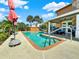Relaxing kidney-shaped pool with brick coping and patio at 102 Via Duomo, New Smyrna Beach, FL 32169