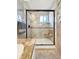 Large walk-in shower with a built-in seat and marble tile at 102 Via Duomo, New Smyrna Beach, FL 32169