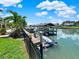 Private boat dock with covered slip and kayak storage at 102 Via Duomo, New Smyrna Beach, FL 32169