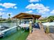 Covered boat lift providing protection for your vessel at 102 Via Duomo, New Smyrna Beach, FL 32169