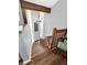 Elegant curved staircase with chandelier and wood accents at 102 Via Duomo, New Smyrna Beach, FL 32169