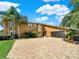 Stunning two-story house with a large driveway at 102 Via Duomo, New Smyrna Beach, FL 32169