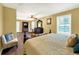 Spacious bedroom with a large bed and sitting area at 102 Via Duomo, New Smyrna Beach, FL 32169