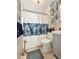 Clean bathroom with updated shower and tropical-themed decor at 102 Via Duomo, New Smyrna Beach, FL 32169