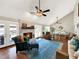 Living room with fireplace, hardwood floors and access to patio at 102 Via Duomo, New Smyrna Beach, FL 32169