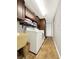 Laundry room with washer, dryer, and extra storage at 102 Via Duomo, New Smyrna Beach, FL 32169