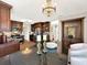 Kitchen island with seating and elegant chandelier at 102 Via Duomo, New Smyrna Beach, FL 32169