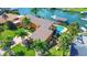 Bird's-eye view of a waterfront house, pool, and boat dock at 102 Via Duomo, New Smyrna Beach, FL 32169