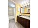 Updated bathroom with granite vanity, mirror, and shower/tub combo at 6337 Parc Corniche Dr # 2104, Orlando, FL 32821