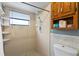 Clean bathroom with shower, tile flooring, and built-in shelving at 636 Koala Ct, Poinciana, FL 34759