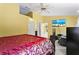 Spacious bedroom with ensuite access and sitting area at 636 Koala Ct, Poinciana, FL 34759