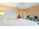 Bright bedroom with built-in closet and TV stand at 636 Koala Ct, Poinciana, FL 34759