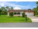 Single-story home with attached garage and manicured lawn at 636 Koala Ct, Poinciana, FL 34759