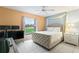 Bedroom with a queen bed and a view of the backyard at 636 Koala Ct, Poinciana, FL 34759