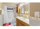 Bathroom features a bathtub, toilet, and wood vanity at 636 Koala Ct, Poinciana, FL 34759