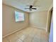 Bright bedroom with tile floor and ceiling fan at 4100 Dijon Dr # 4100E, Orlando, FL 32808
