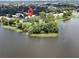 Aerial view showcasing waterfront property and surrounding landscape at 4100 Dijon Dr # 4100E, Orlando, FL 32808